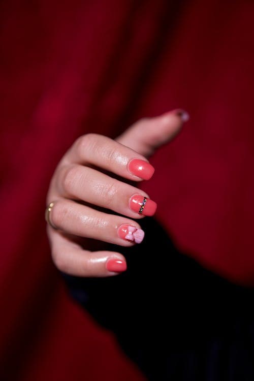 Close-up of red manicure on hand